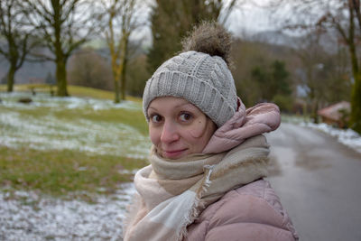 Portrait of young woman in snow