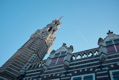 Low angle view of building against blue sky