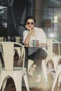 Portrait of woman having coffee at outdoor cafe