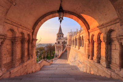 Archway of historic building against sky