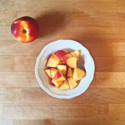 Directly above shot of apples in bowl on table