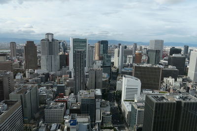 High angle view of buildings in city against sky