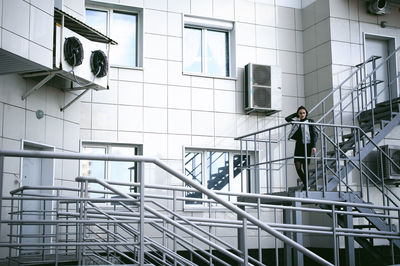 Young woman walking on steps