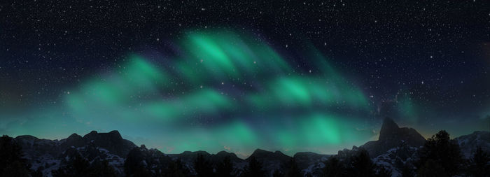 Low angle view of mountain against sky at night