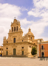 View of historic building against cloudy sky