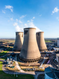 A vertical aerial view of a group of cooling towers at a coal fired power station