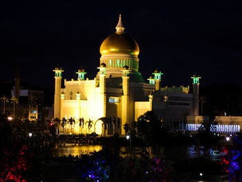 Illuminated buildings in city at night