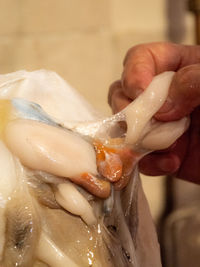 Cropped hand of person washing hands