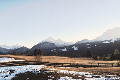 Scenic view of mountains against clear sky during winter