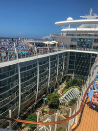 High angle view of crowd at beach against buildings in city