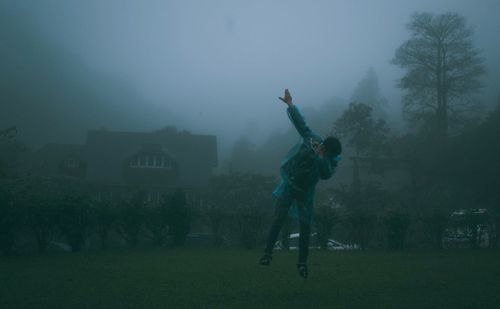 Full length of man on field against trees