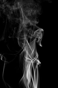 Close-up of smoke against black background