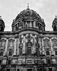 Low angle view of cathedral against cloudy sky