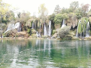 Panoramic view of rocks in river against sky