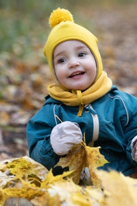 Portrait of smiling boy in snow