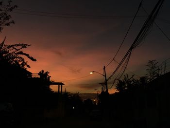 Silhouette trees against sky during sunset