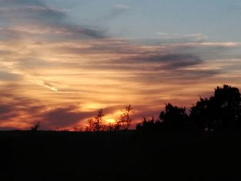 Scenic view of dramatic sky during sunset