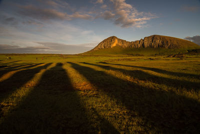 Moai's shadows at ahu tongariki, during the sunrise. easter island, valparaiso, chile.