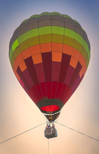 Low angle view of hot air balloon flying in sky