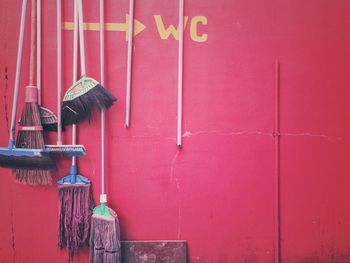 Close-up of pink closed metal door against wall