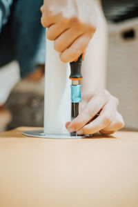 Midsection of man working at table