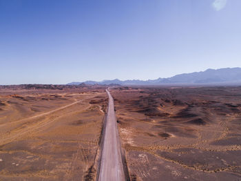 Scenic view of desert against clear sky