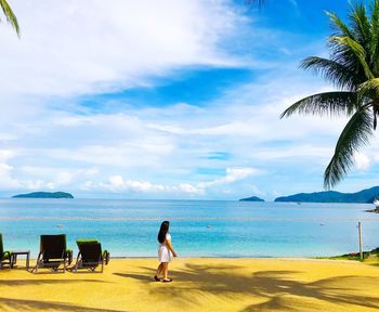 Woman walking on beach