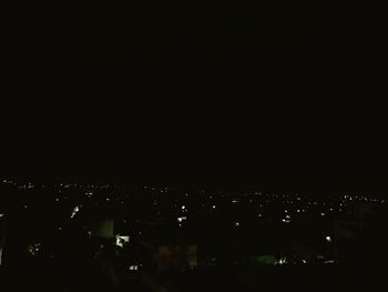 High angle view of illuminated buildings in city at night