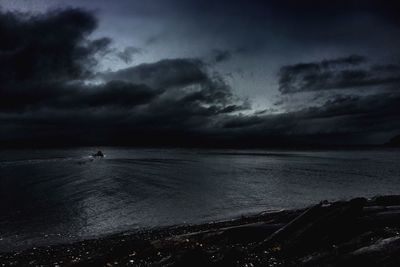 Scenic view of sea against cloudy sky