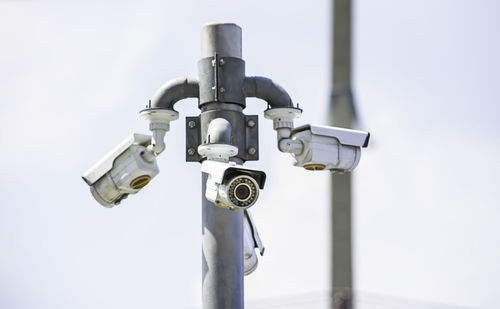 Low angle view of electric lamp against white background