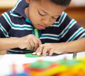 Close-up of boy playing with toy