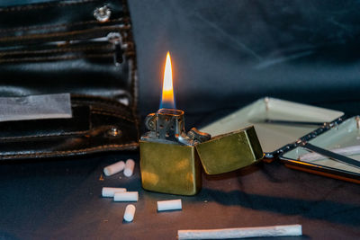 High angle view of illuminated candles on table