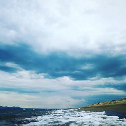 Scenic view of shore against sky