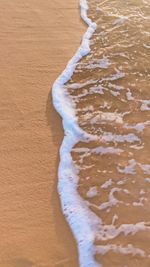 High angle view of surf on beach