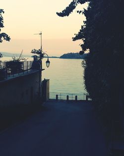 Scenic view of sea against clear sky at sunset