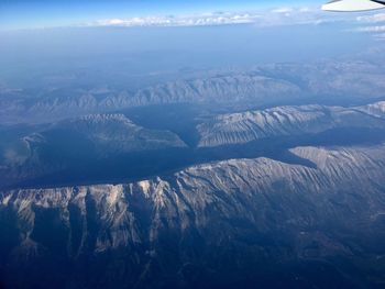 Scenic view of mountains against sky during winter