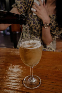 Close-up of beer glass on table