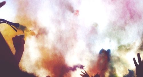 Low angle view of people against sky