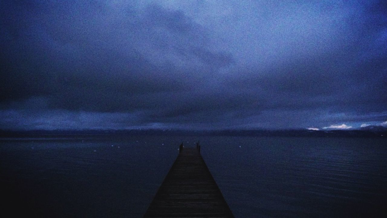 sky, water, cloud - sky, sea, tranquility, tranquil scene, scenics, cloudy, beauty in nature, the way forward, pier, nature, dusk, cloud, horizon over water, weather, idyllic, jetty, overcast, outdoors