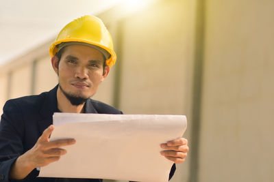 Mid adult man working at construction site