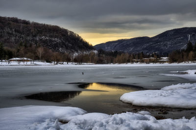 Scenic view of snowcapped mountains against sky during winter