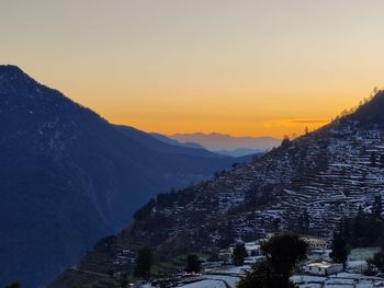 Scenic view of mountains against sky during sunset