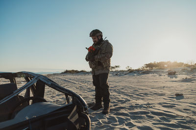 Side view of man standing on beach