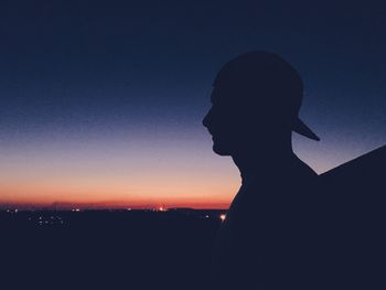 Silhouette of man against clear sky