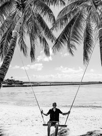 Full length of man on beach against sky