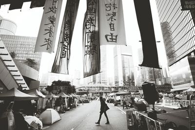 Rear view of man walking on city street