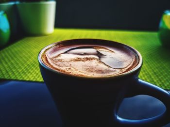 Close-up of coffee cup on table