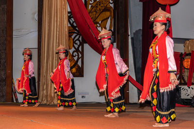 Group of people in traditional clothing during festival