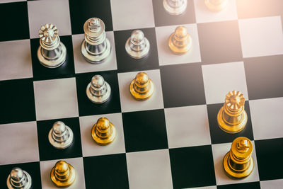 High angle view of chess pieces on table