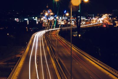 High angle view of light trails on road at night